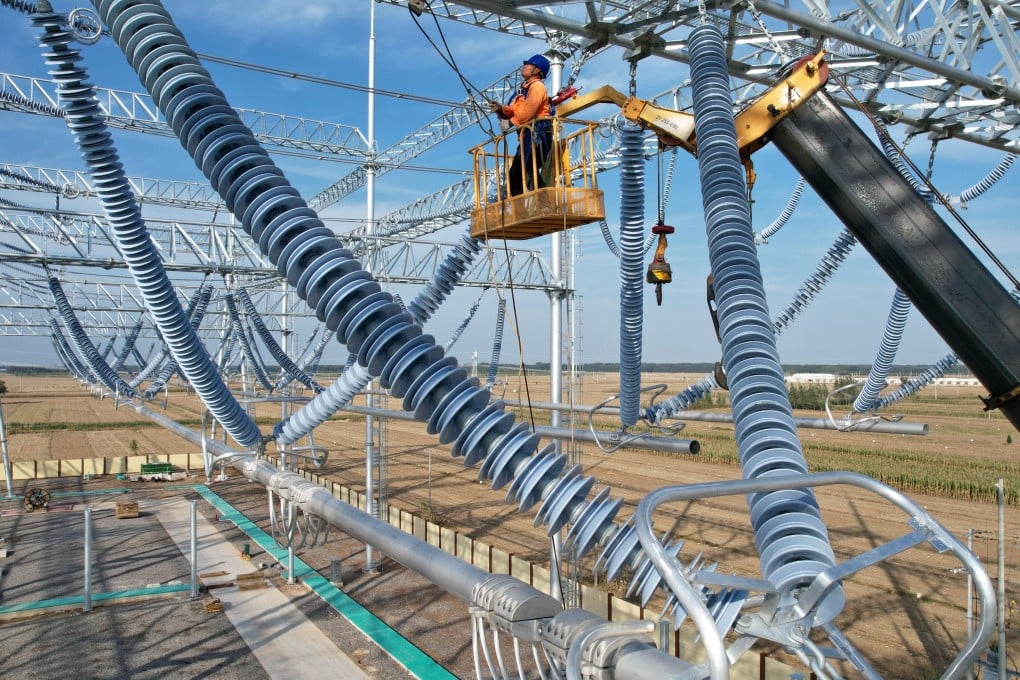 Workers are seen at a power substation in China’s Hebei province. Photo: Xinhua