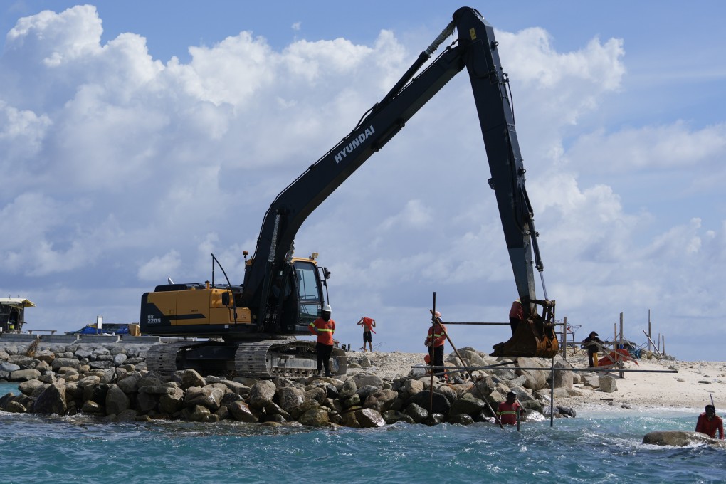 Construction takes place on the Philippine-occupied Thitu island, locally called Pagasa, in November 2024. Photo: AP