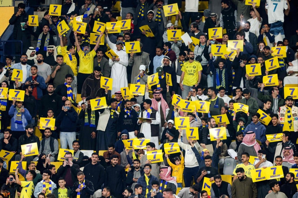 Supporters of Saudi football club Al-Nassr hold placards showing the number and name of non-playing Portuguese forward Cristiano Ronaldo during the Saudi Pro League match against Al-Ittihad in Riyadh last Friday. Photo: AFP
