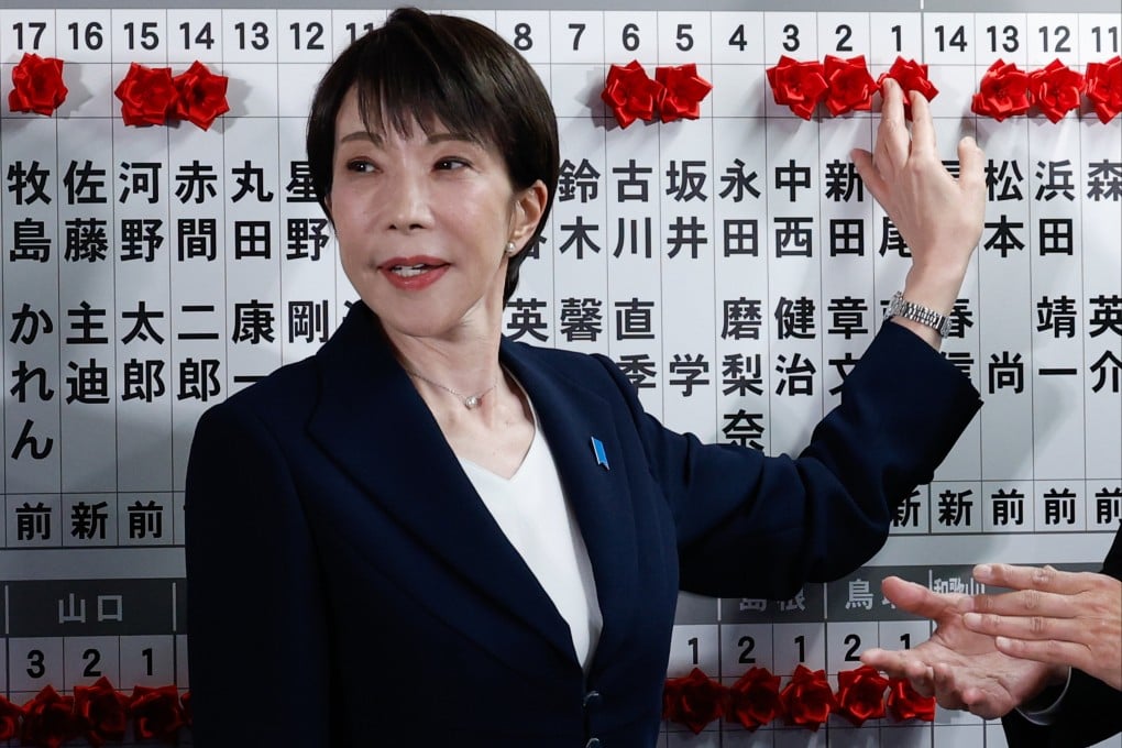Sanae Takaichi, Japan’s prime minister and president of the ruling Liberal Democratic Party, puts in pins marking the names of candidates who won lower house elections, at the LDP headquarters in Tokyo, on February 8. Photo: AP