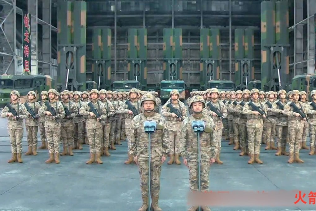 Members of the People’s Liberation Army stand at attention as Chinese President Xi Jinping inspects their combat readiness via video link in Beijing on Tuesday. Photo: Xinhua