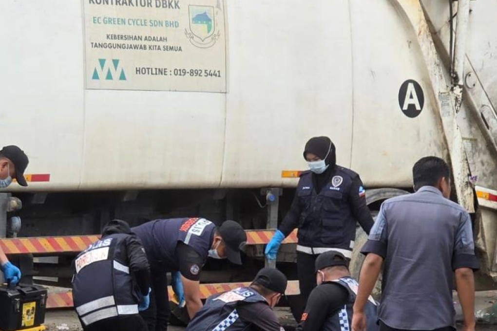 Malaysian police officers investigate a crime scene in Indah Permai, Kota Kinabalu. Photo: The Star