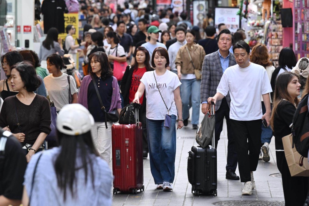 Tourists walk through Myeong-dong in Seoul, in September 2025. A rising number of  Chinese tourists are visiting South Korea for skin treatments. Photo: The Korea Times