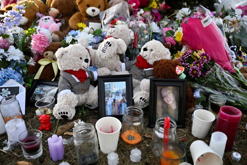 Candles, flowers, photographs and plush toys at a makeshift memorial for the victims in Tumbler Ridge. Photo: Reuters