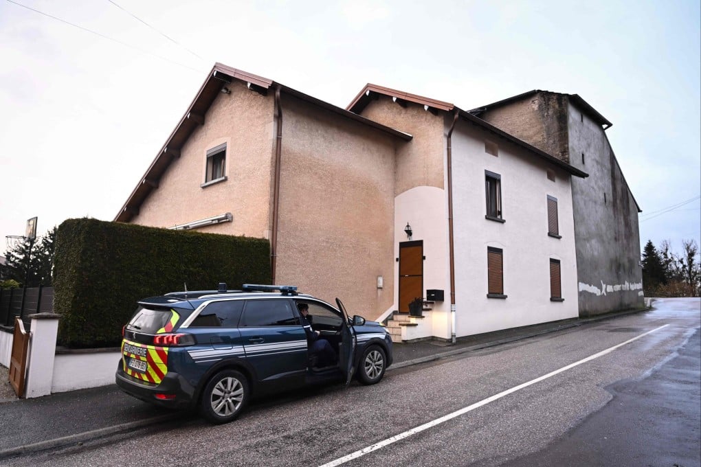 Law enforcement outside the house where the bodies of two infants were discovered in a freezer in Ailleviller-et-Lyaumont, eastern France on February 12, 2026. Photo: AFP