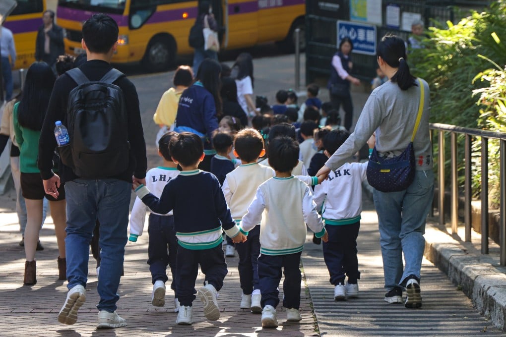Kindergarten pupils and teachers pass Kowloon Park on December 17. Photo: Jelly Tse