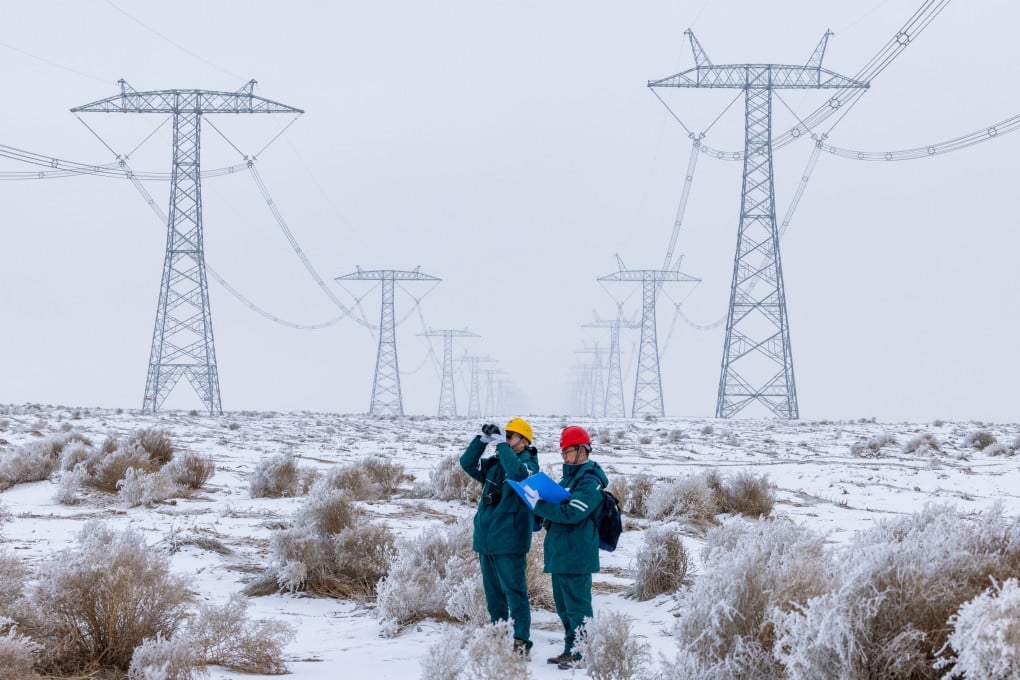 Workers patrol a section of an ultra-high-voltage power transmission line in China’s northwestern Xinjiang Uygur autonomous region. Photo: Xinhua