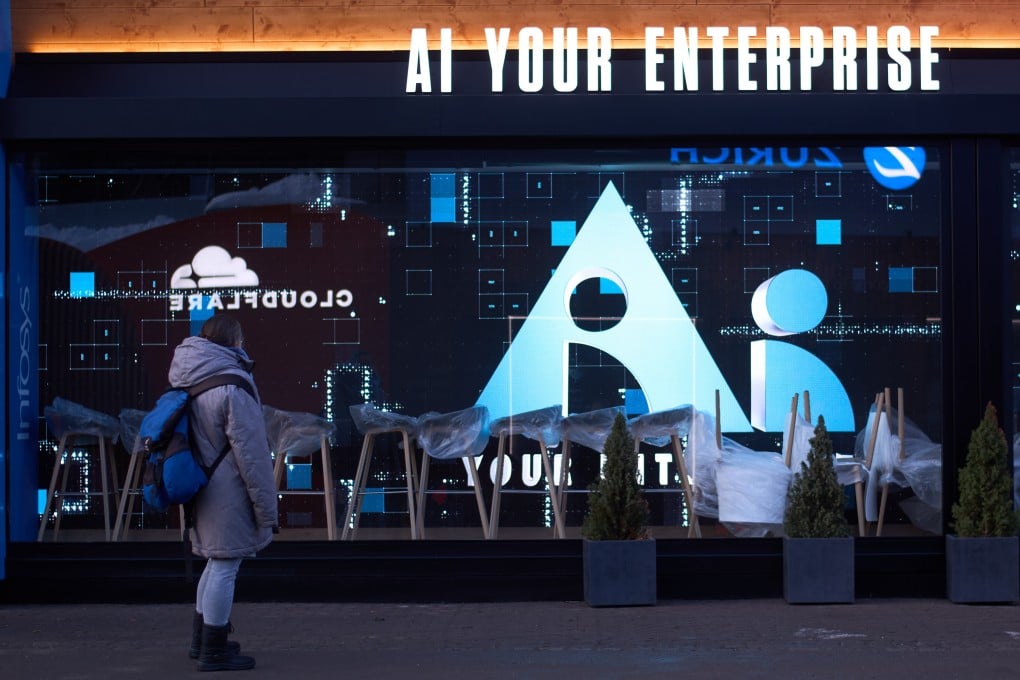 A woman looks at the window of a company advertising AI ahead of the annual meeting of the World Economy Forum in Davos, Switzerland, on January 17. Photo: AP