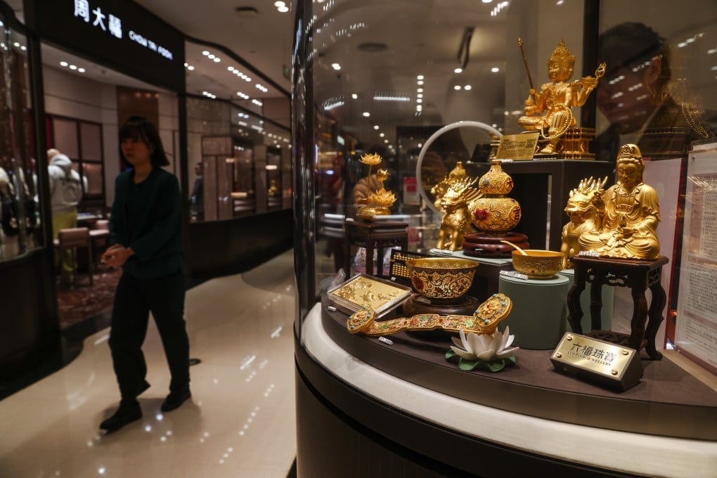 Decorative items made of gold are displayed at a jewellery store in Beijing on January 28. Photo: EPA-EFE