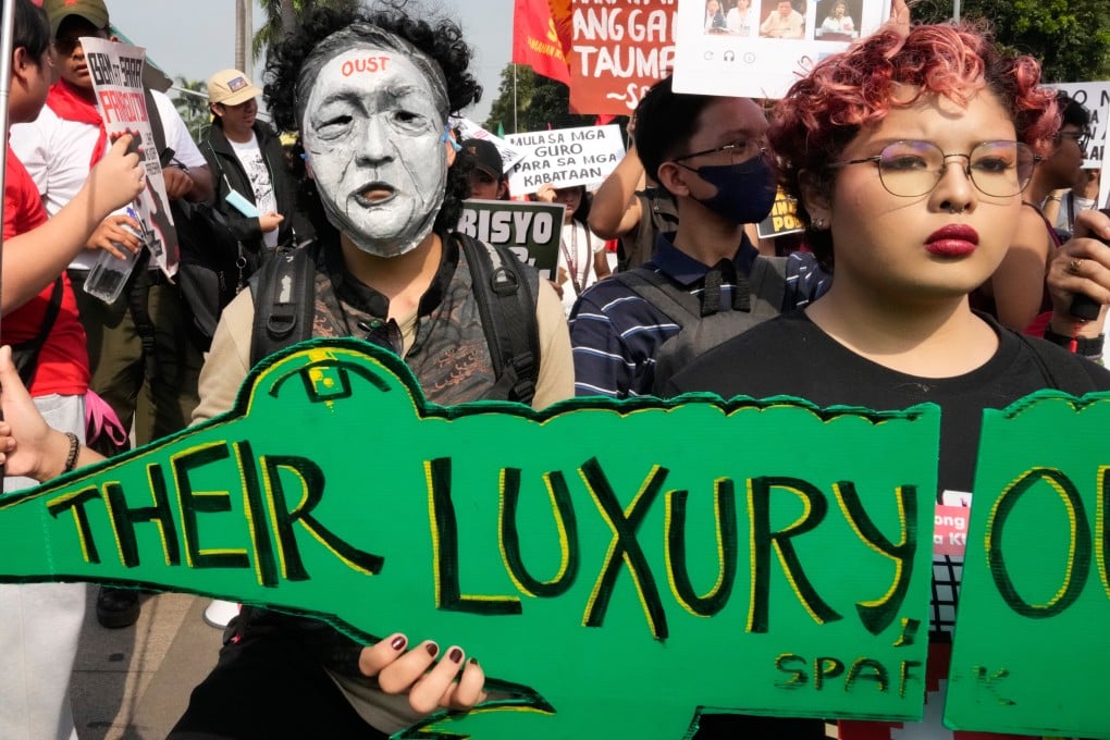 Protesters, one wearing a mask of President Ferdinand Marcos Jnr, take part in an anti-corruption protest in Manila, the Philippines, on November 30, 2025. Photo: AP