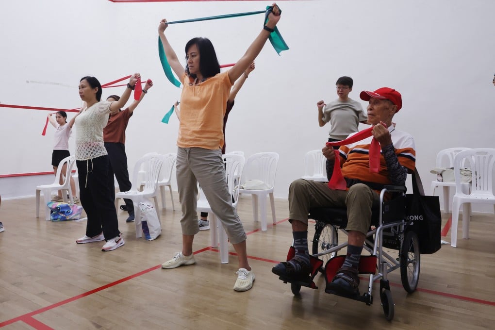 People perform resistance band fitness exercises at Kowloon Park Sports Centre on August 3, 2025. Photo: Edmond So
