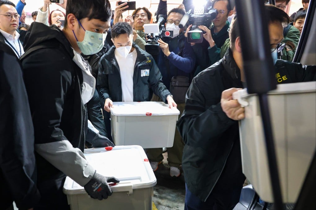 Police raid a lawyer’s office in connection with so-called crash-for-cash scams. Photo: Handout