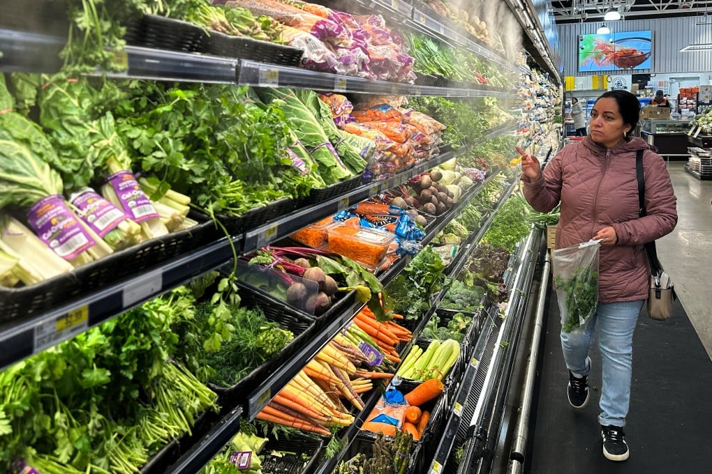 A shopper looks at vegetables in a grocery store in Schaumburg, Illinois, on Monday. Photo: AP