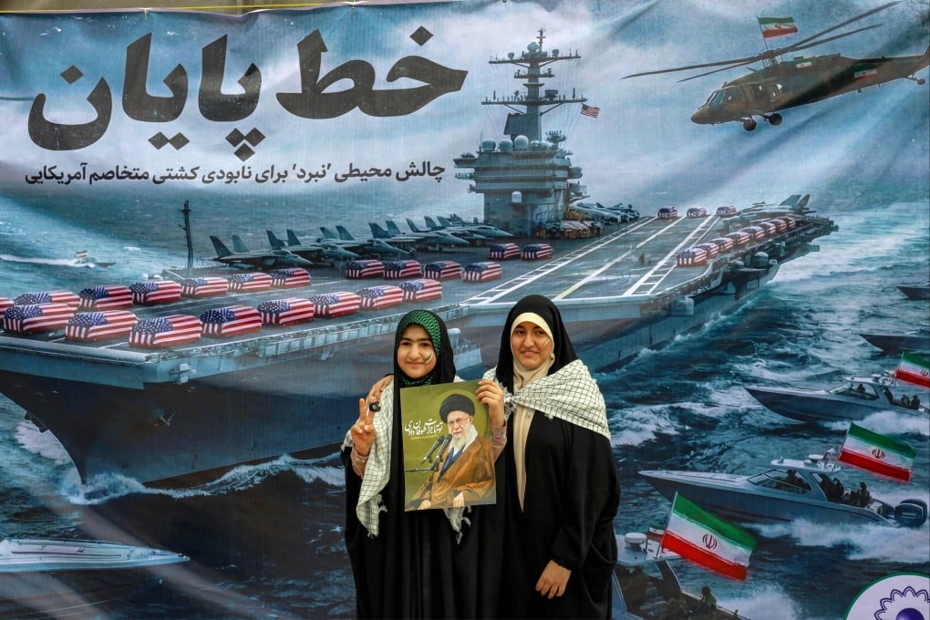 Women pose with a poster depicting Iran’s Supreme leader Ayatollah Ali Khamenei during a rally in Tehran on Wednesday marking the 47th anniversary of the 1979 Islamic revolution. Photo: AFP