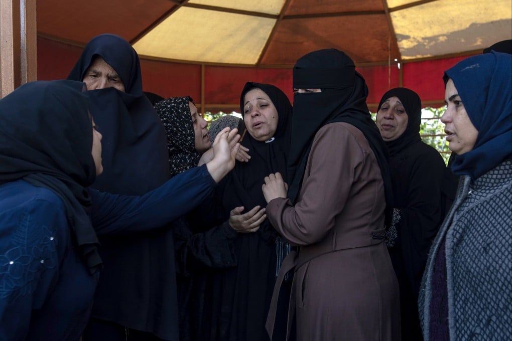 Palestinians mourn during funerals in the southern Gaza Strip on Sunday. Photo: EPA