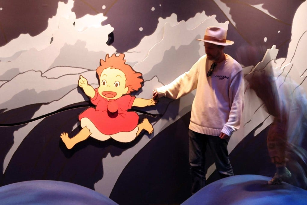 A visitor interacts with a Ponyo exhibit at “Studio Ghibli’s Ponyo”, a new exhibition at the Academy Museum of Motion Pictures in Los Angeles, on February 12, 2026. Photo: AFP