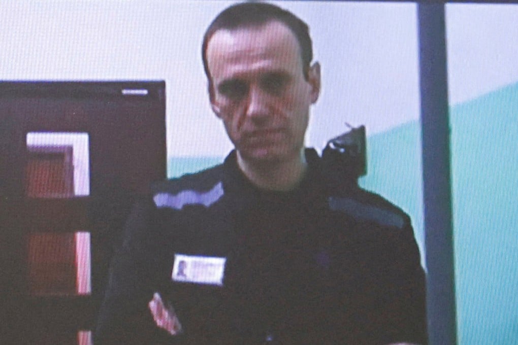 Alexei Navalny appearing on a screen via video link from the IK-6 penal colony in 2023. Photo: Reuters