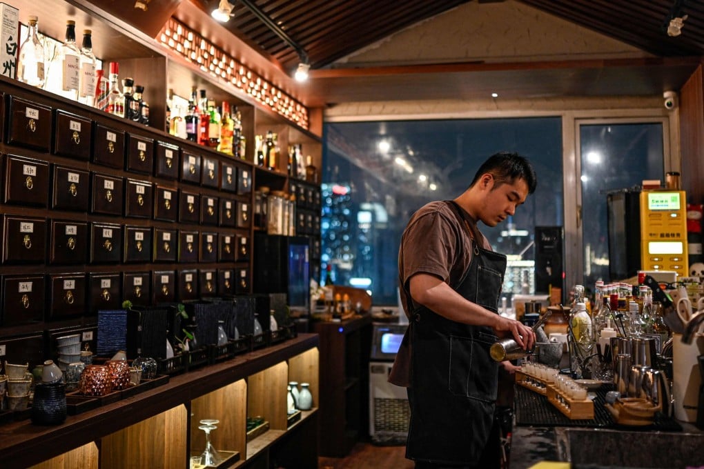 A bartender prepares shots at Niang Qing, a “TCM bar” in Shanghai, China. Similar bars based on traditional Chinese medicine have popped up in cities across China, epitomising what the country’s stressed-out, time-poor youth refer to as “punk wellness”, or “wrecking yourself while saving yourself”. Photo: AFP