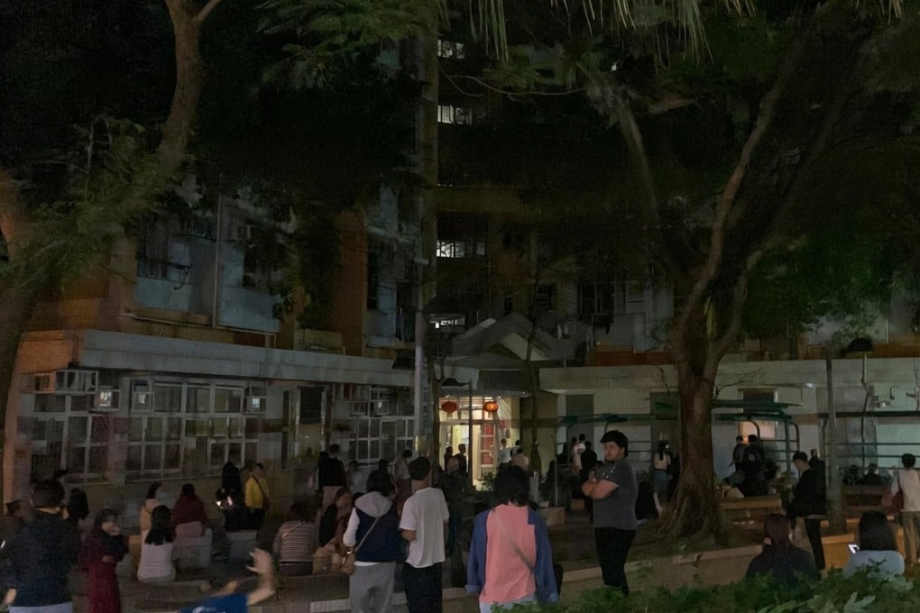 The power outage left the building in pitch darkness, prompting many residents to wait outside. Photo: Handout