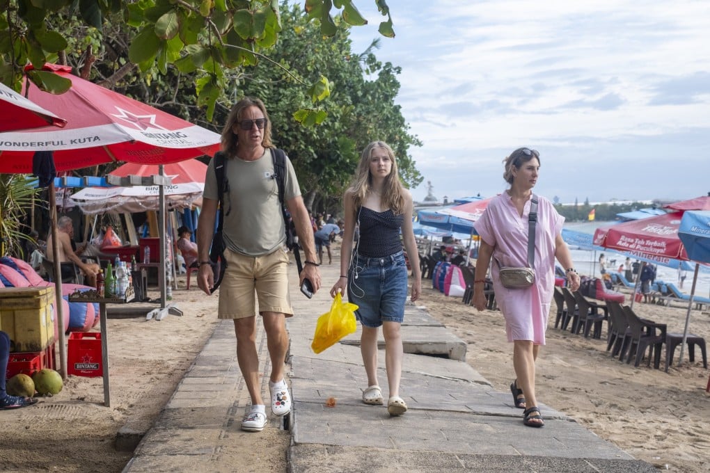 Tourists walk through a shopping area in Kuta, Bali, Indonesia. Photo: EPA