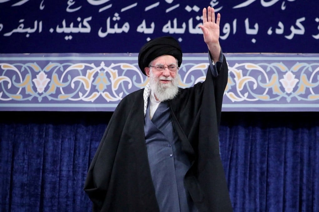 Iran’s supreme eader Ali Khamenei waves during a meeting in Tehran on Tuesday. Photo: Office of the Iranian Supreme Leader/Reuters