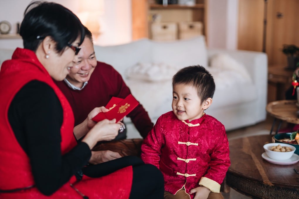 Giving red packets (also called lai see or hong bao) is a Lunar New Year tradition, but when should you open them? Photo: Getty Images