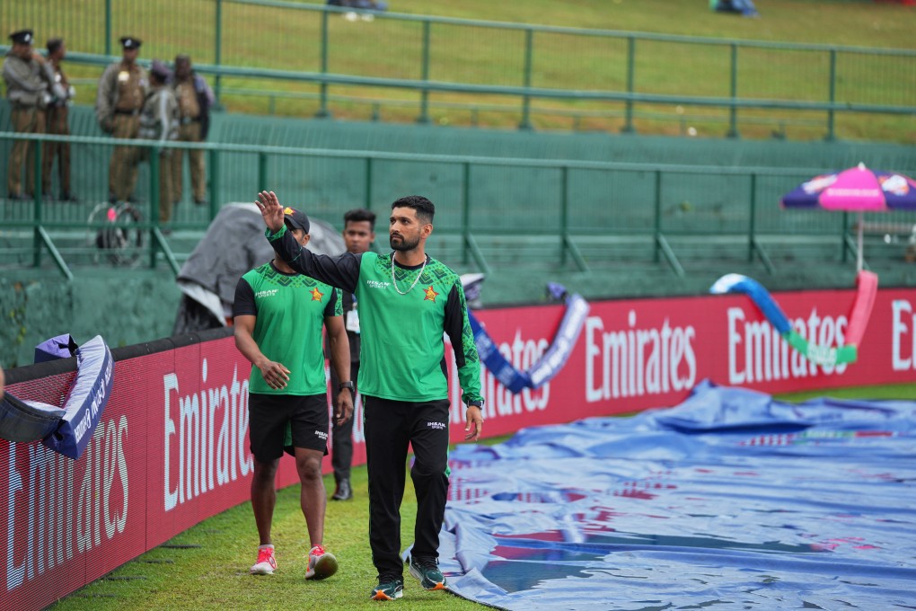 Zimbabwe captain Sikandar Raza waves to supporters as rain led to the cancellation of the T20 World Cup match between Ireland and Zimbabwe in Pallekele, Sri Lanka on Tuesday. Photo: AP