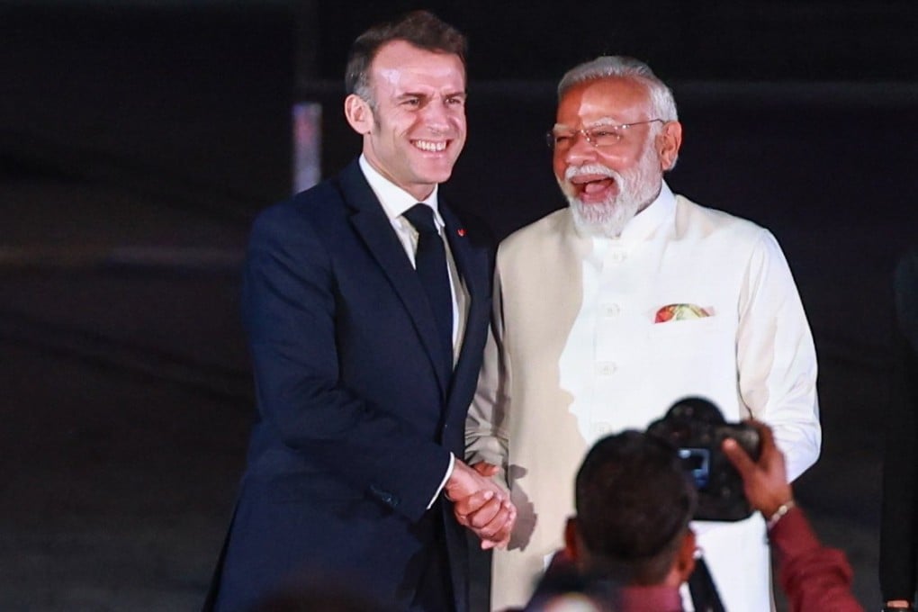French President Emmanuel Macron and Indian Prime Minister Narendra Modi shake hands as they arrive for the India-France Year of Innovation and Cultural Commemoration event in Mumbai on Tuesday. Photo: EPA