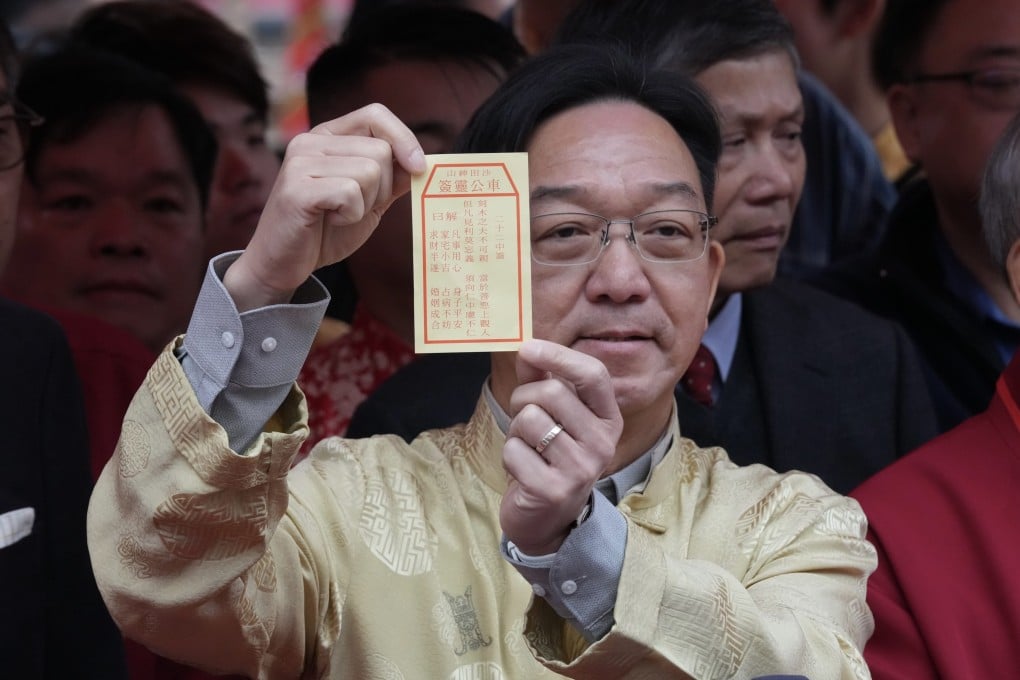 Kenneth Lau has drawn a “neutral” stick for Hong Kong at Che Kung Temple in Sha Tin on the second day of the Year of the Horse. Photo: Jelly Tse