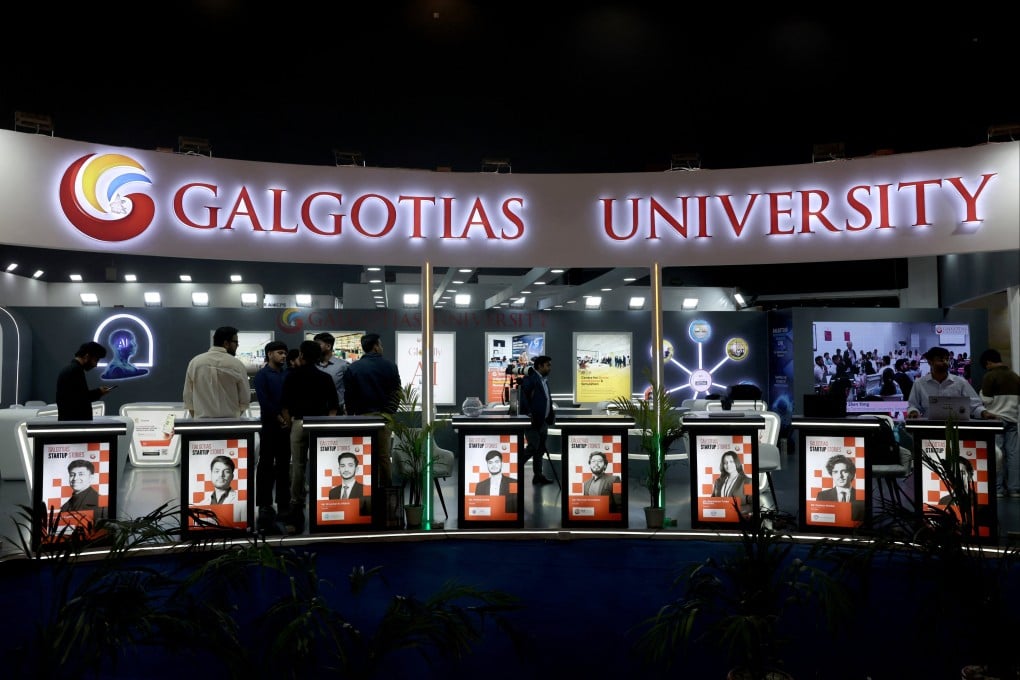 Visitors stand at Galgotias University’s kiosk during the AI Impact Summit in New Delhi on Wednesday. Photo: Reuters