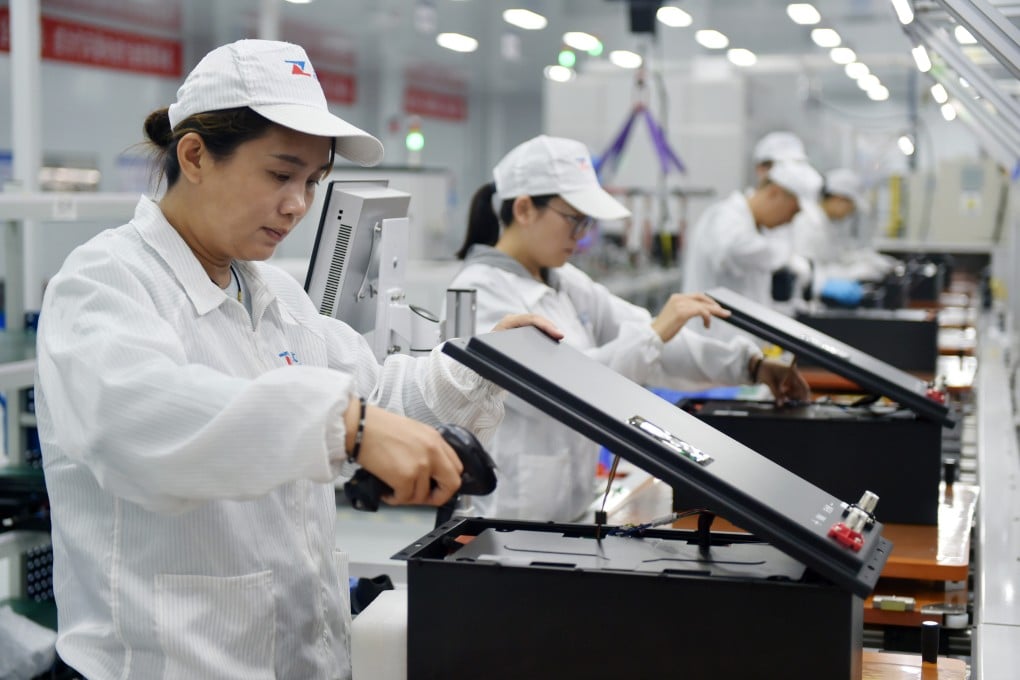 Workers produce lithium batteries in Qinyang, central China’s Henan province. Photo: Xinhua