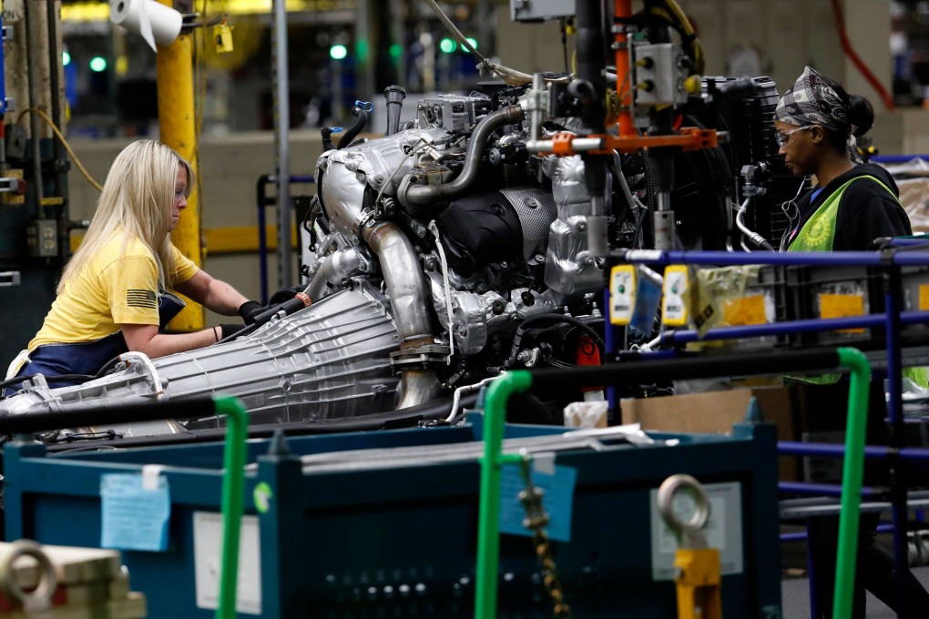 Line workers assemble a chassis of a General Motors pickup truck at the Flint Assembly plant in Michigan. Photo: AFP
