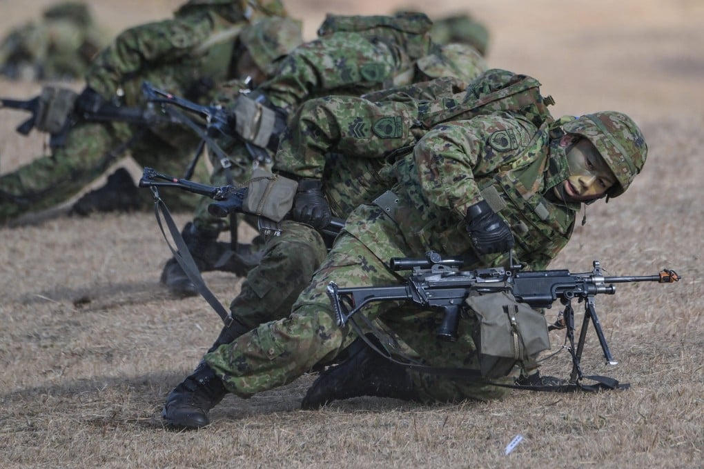 Japanese troops take position during a joint military exercise in 2024. Photo: AFP