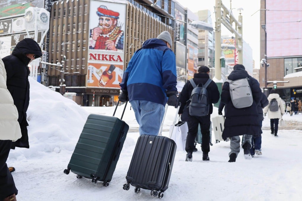 Travellers cross the road in Sapporo. Photo: Kyodo