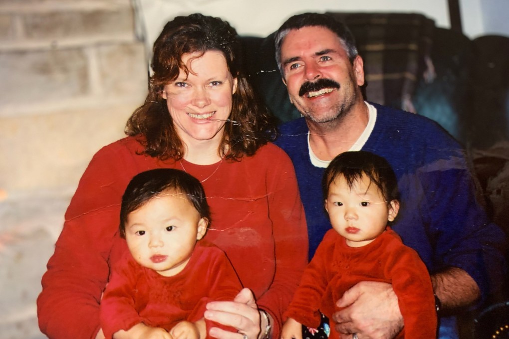 Phoebe McChesney, left, with her twin sister and parents in the US, after their adoption from Hunan, China. Photo: Handout