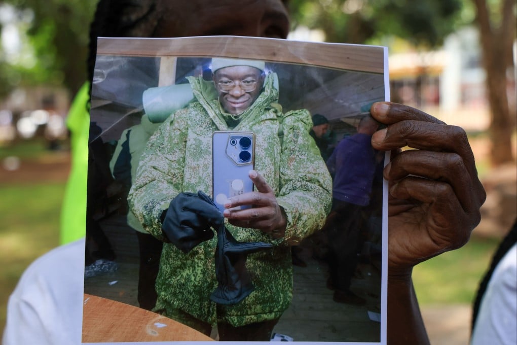 A family member holds a photo of Kenyan who joined the Russian army. Photo: AP