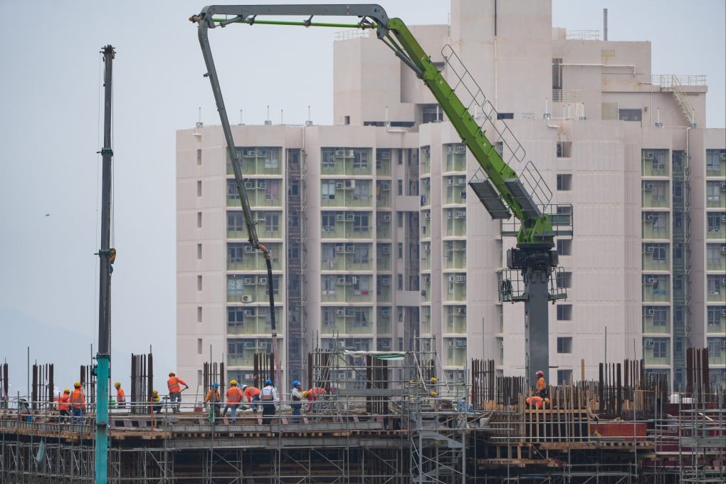 Workers at a construction site beside a public housing estate in Sau Mau Ping on February 12. Photo: Sam Tsang