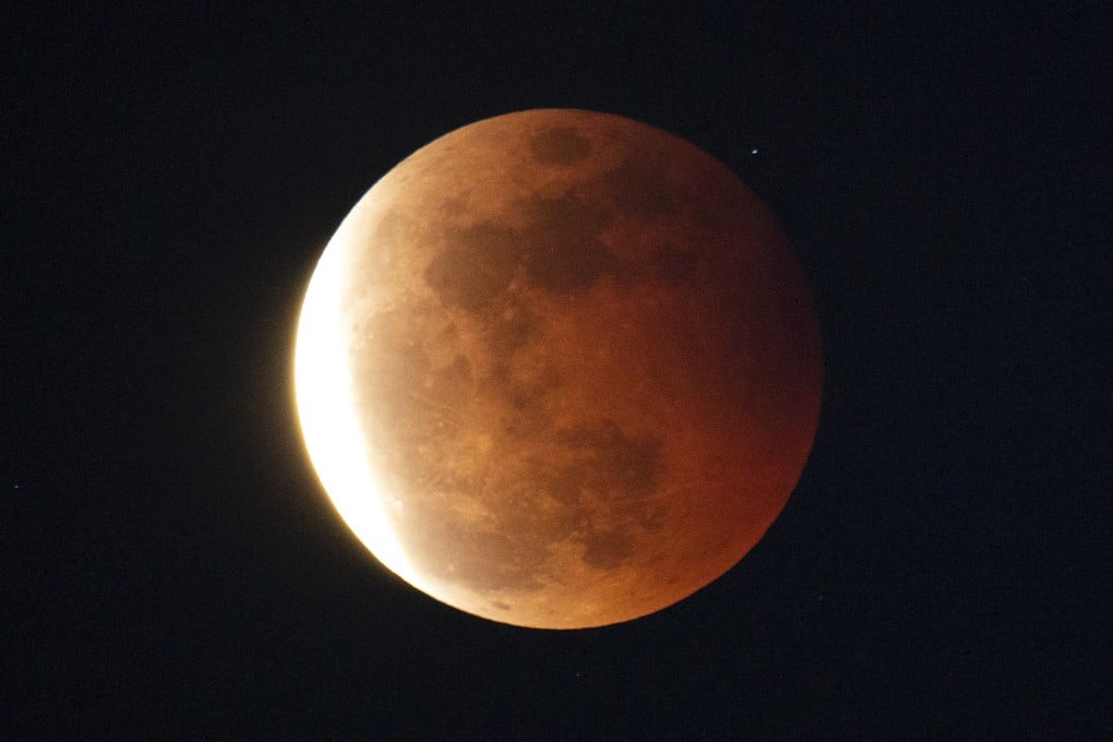 A “blood moon” lunar eclipse was seen above Hong Kong on May 26, 2021. Photo: Sam Tsang