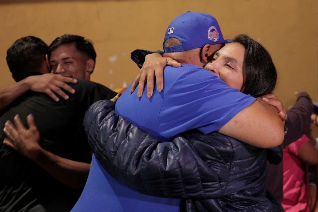 Relatives of detainees embrace outside a detention centre following the approval of Venezuela’s amnesty law. Photo: Reuters