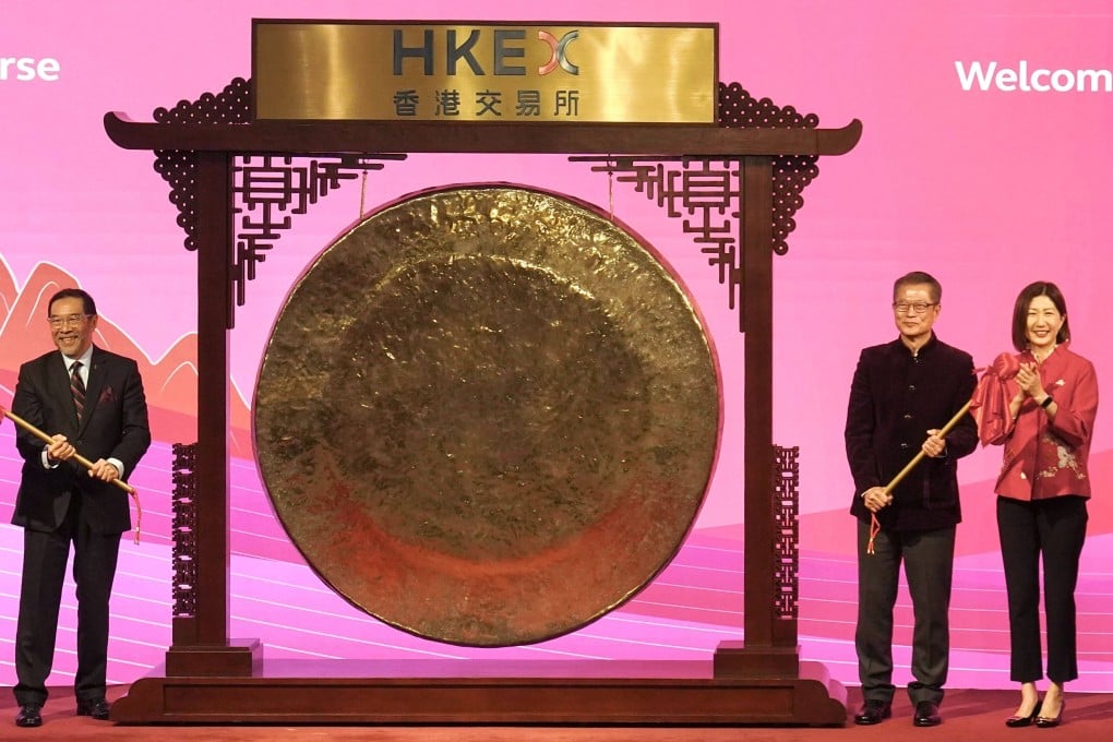 (From left) HKEX chairman Carlson Tong, Financial Secretary Paul Chan and HKEX CEO Bonnie Chan attend the Lunar New Year market opening ceremony at the stock exchange on Friday. Photo: Karma Lo