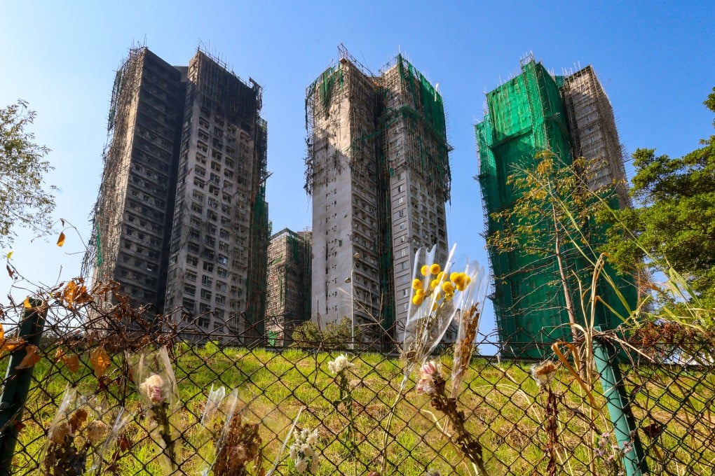 Flowers are seen on January 5 in front of the Wang Fuk Court apartment blocks in Tai Po where a deadly fire broke out on November 26, 2025. Photo: Dickson Lee