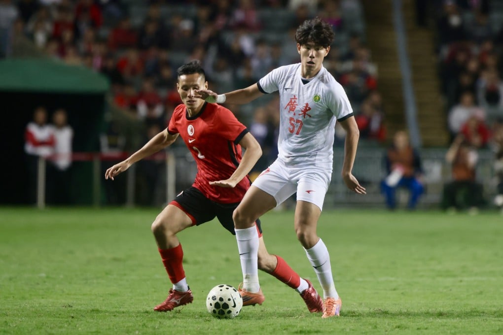 Jacky Leung (left) tracks Wang Xiyang during the first leg of this year’s Guangdong-Hong Kong Cup. Photo: Jonathan Wong