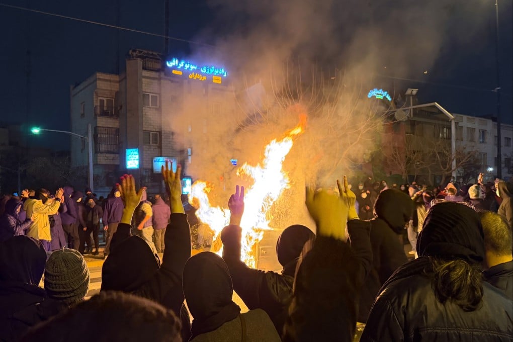 Iranians attend an anti-government protest in Tehran on January 9. Photo: AP