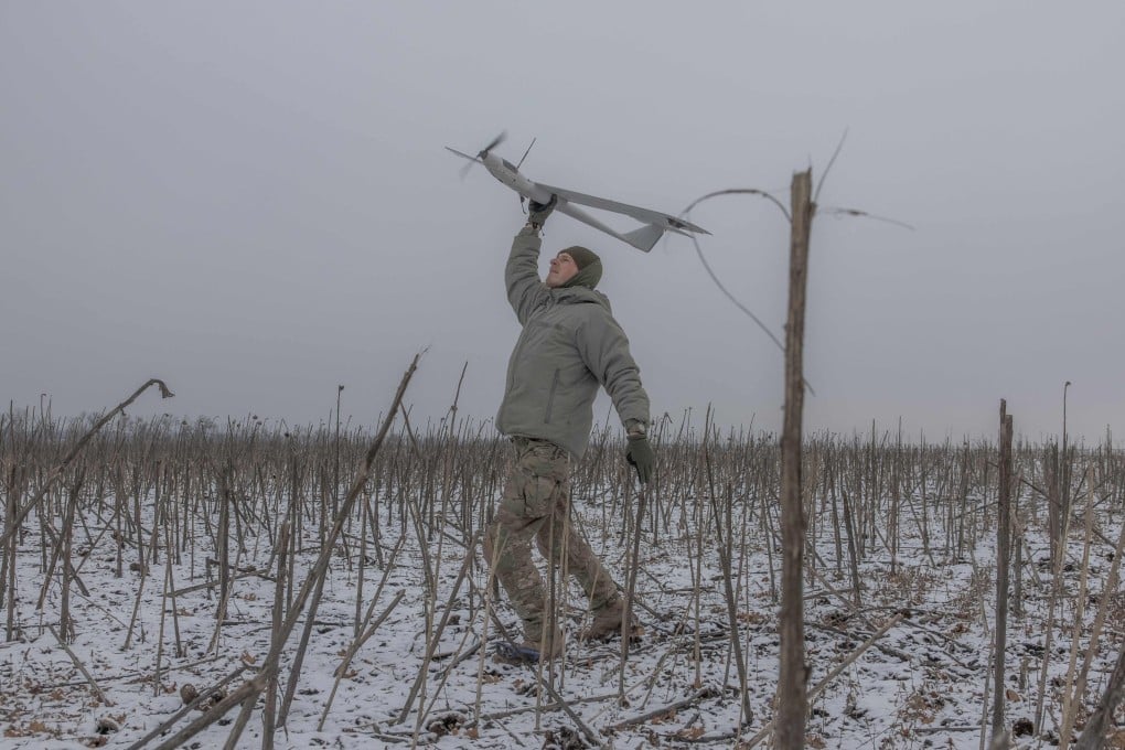 A Ukrainian member of a drone team launches a surveillance drone towards Russian position in the eastern Donetsk region on February 4, amid the Russian invasion of Ukraine. Photo: AFP