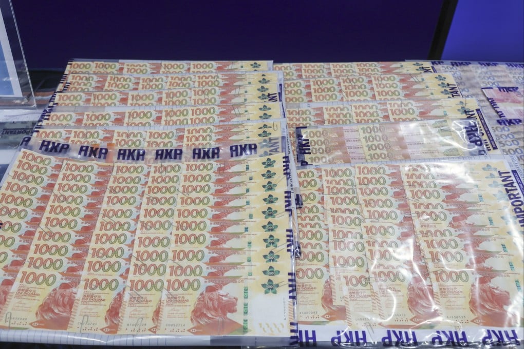 Money seized during an operation combating money laundering is displayed at police headquarters in Wan Chai. Photo: Edmond So