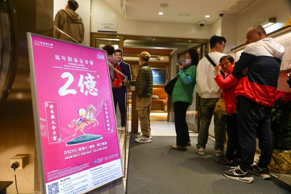 People line up for Mark Six tickets at the Stanley Street Jockey Club branch in Central. Photo: Dickson Lee