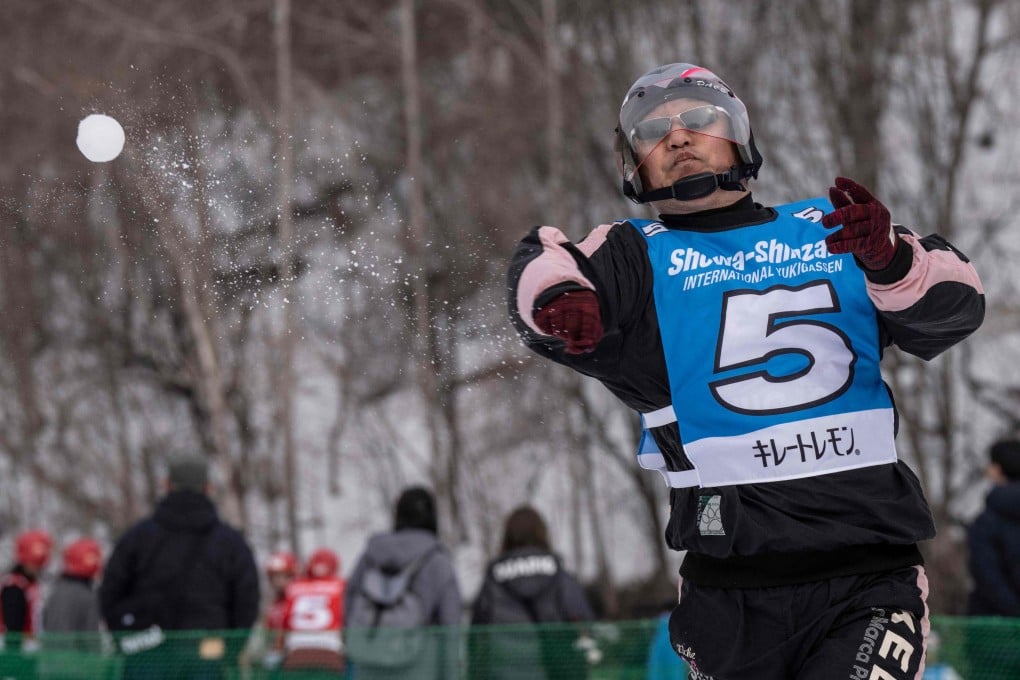 A player throws a snowball during the Showa-shinzan International Yukigassen competition in Sobetsu, Hokkaido prefecture on Saturday. Photo: AFP