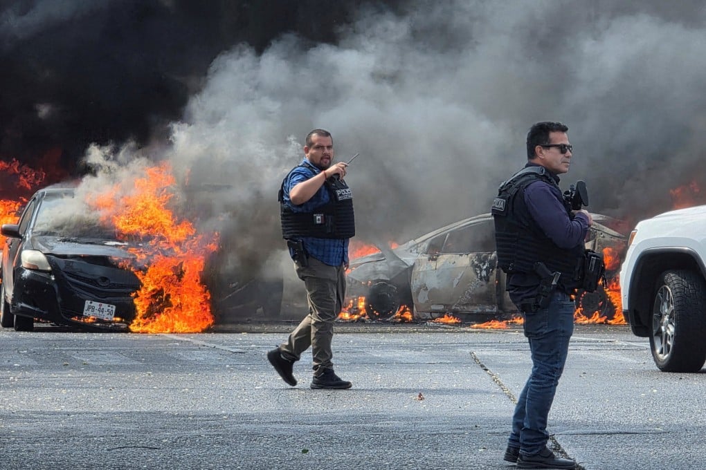 Police secure an area where vehicles were set on fire in Zapopan, Mexico. Photo: Reuters