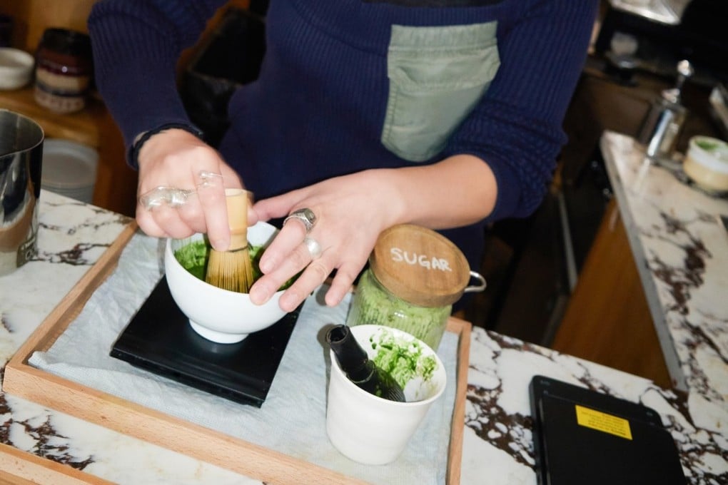 An employee prepares matcha at Look Left by Yugu, a Korean cafe in London that serves matcha and Korean-fusion food. Photo: Instagram/lookleftbyyugu