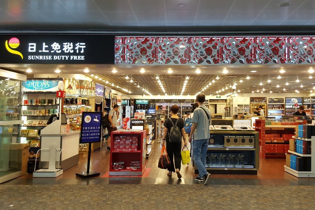 Customers shop at a duty-free store in Shanghai. Chinese travellers spend more at airports than any other passengers in Asia, according to a new study. Photo: Shutterstock